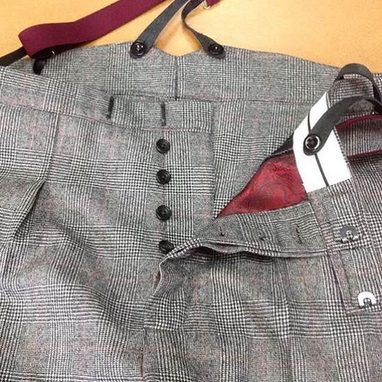 Bespoke trousers with brace tops and button fly.